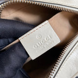 Side profile of premium signature women's handbag – women's designer-style accessory