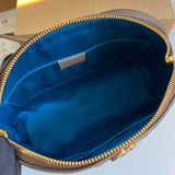 Side profile of polished modern women's handbag – women's luxury handbag
