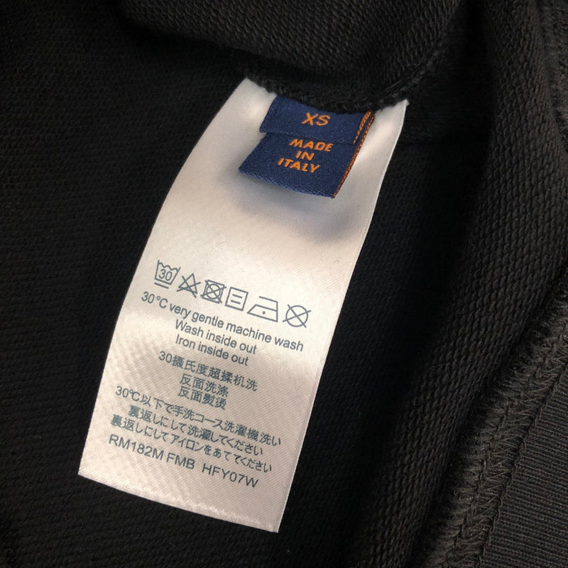 Side profile of Louis Vuitton luxury clothing with tailored silhouette