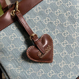 Back view of elevated structured women's handbag – women's designer-style accessory