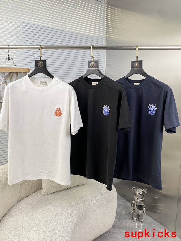 Flat lay presentation of Moncler luxury clothing with relaxed-fit cut