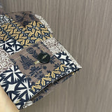 Side profile of Louis Vuitton luxury clothing with logo-detail design
