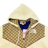 Close-up detail shot of Gucci luxury clothing with label-forward styling