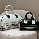 Close-up detail of signature everyday-luxe women's handbag – women's designer-style accessory
