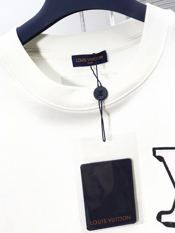 Front view of Louis Vuitton luxury clothing with streetwear-inspired cut