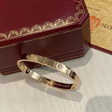 Front view of Cartier unisex jewelry piece