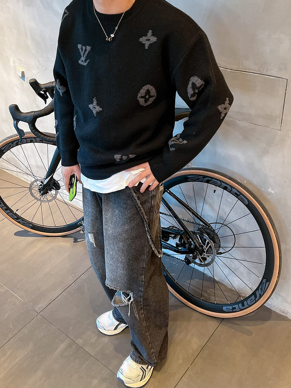 Flat lay presentation of Louis Vuitton luxury clothing with signature branding