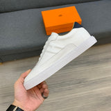 Hermes shoes Style 238 - close-up of statement logo accent