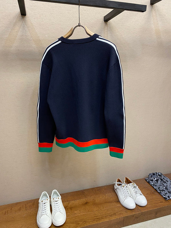 Side profile of Gucci luxury clothing with label-forward styling