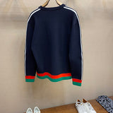 Side profile of Gucci luxury clothing with label-forward styling