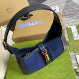 Handle and strap detail of polished signature women's handbag – women's designer-style accessory