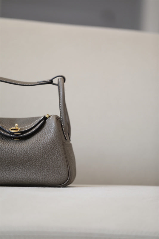 Side view of curated structured handbag