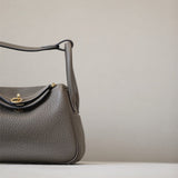Side view of curated structured handbag