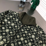 Close-up detail shot of Louis Vuitton luxury clothing with signature branding