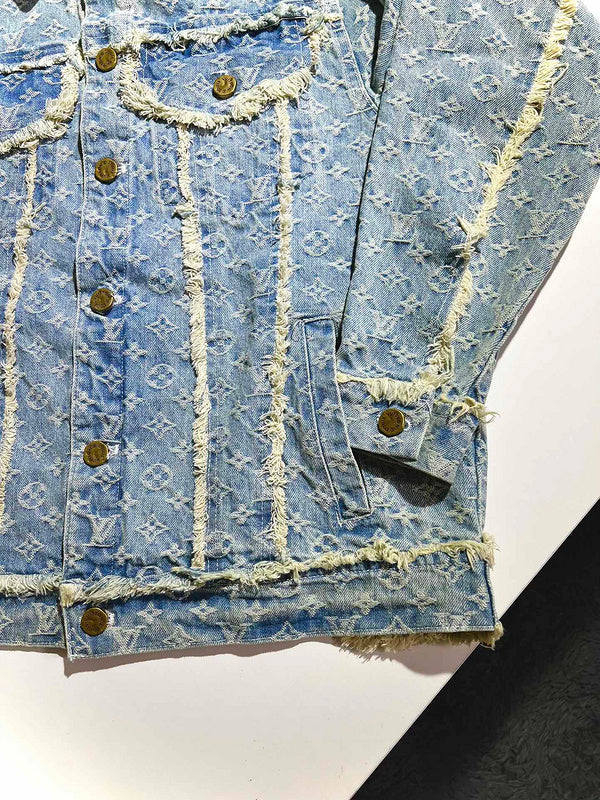Flat lay presentation of Louis Vuitton luxury clothing with signature branding