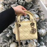 Close-up detail of structured signature women's handbag – women's designer-style accessory