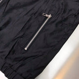 Flat lay presentation of Louis Vuitton luxury clothing with signature branding