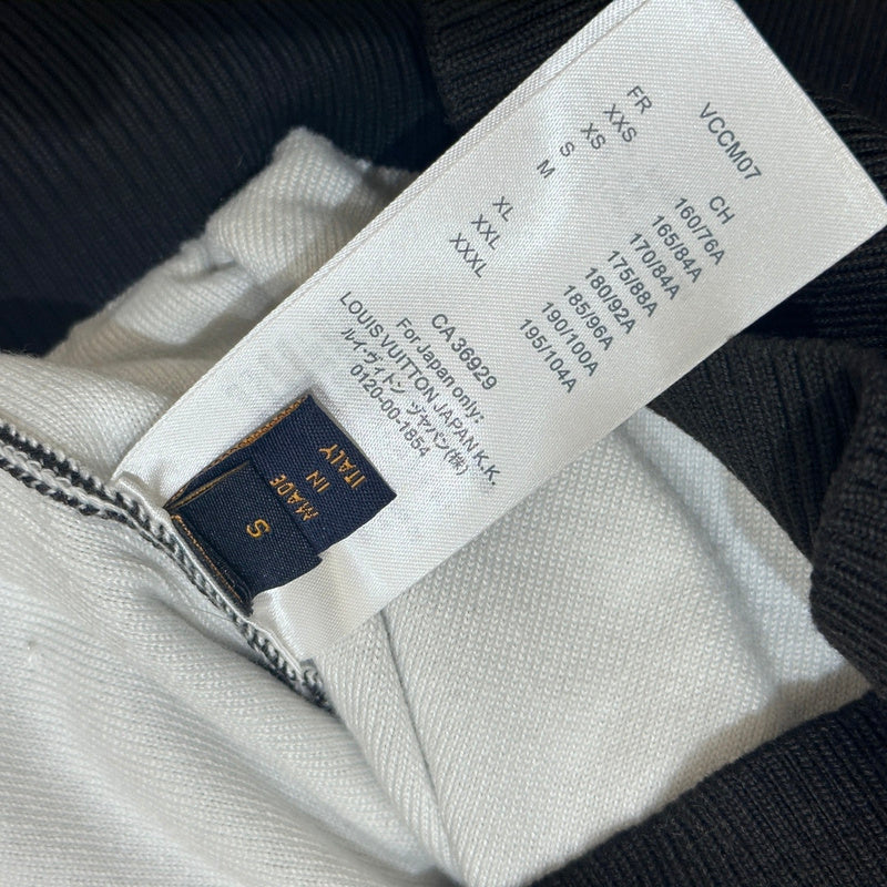 Front view of Louis Vuitton luxury clothing with label-forward styling