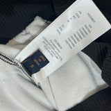 Front view of Louis Vuitton luxury clothing with label-forward styling