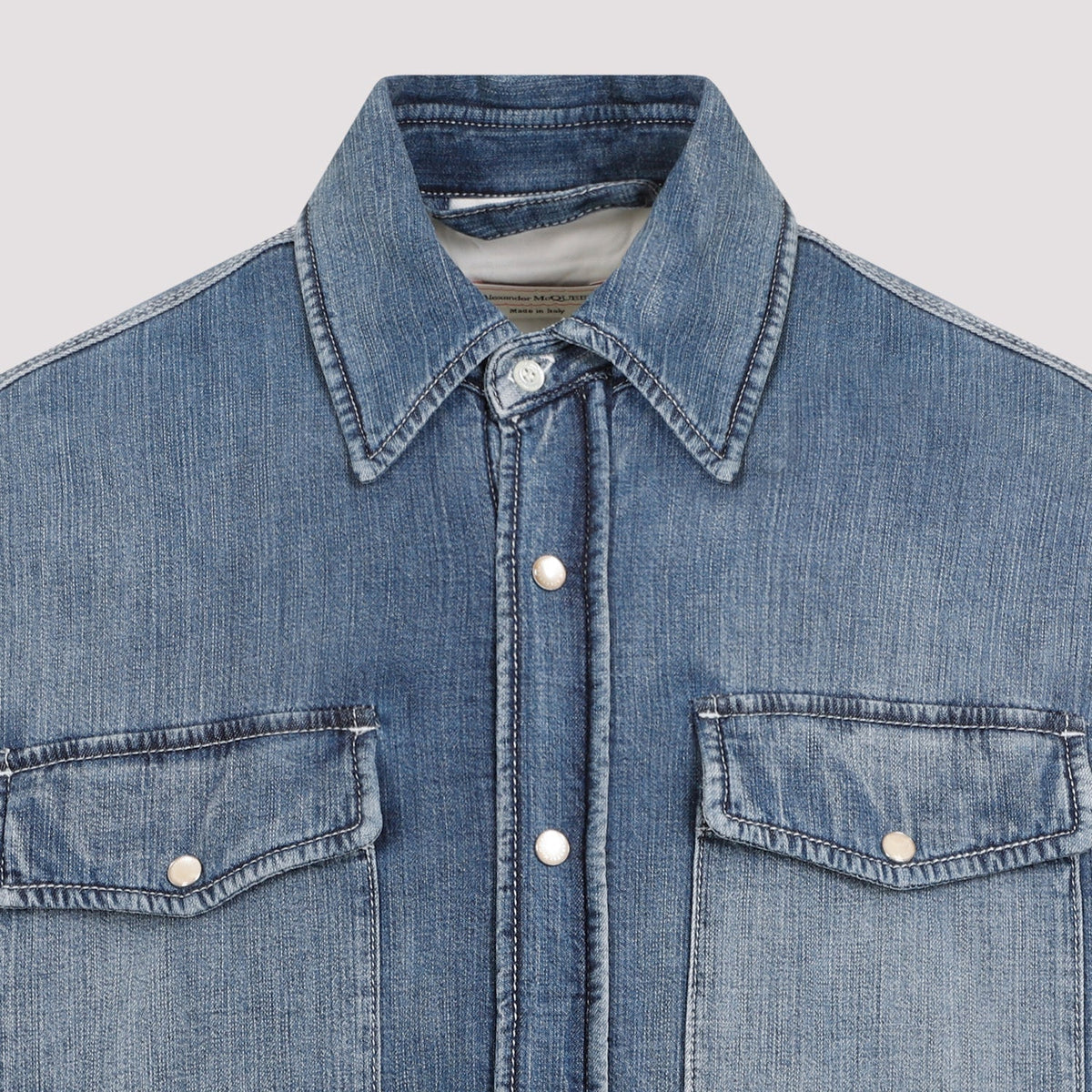Close-up of Alexander McQueen blouses hardware and fine stitching