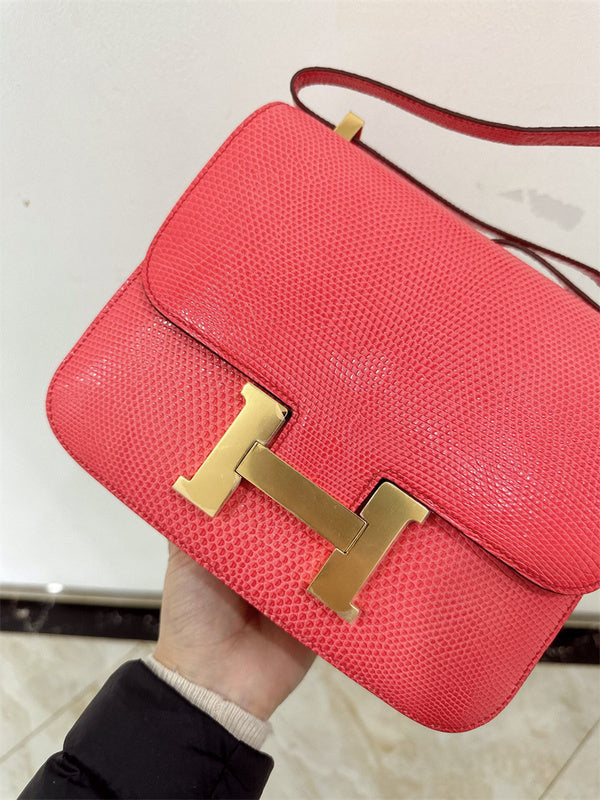  Signature top-handle bag carried on shoulder 10