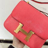  Signature top-handle bag carried on shoulder 10