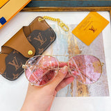Close-up detail view of Louis Vuitton unisex sunglasses