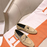 Hermès Grey Bow-Detail Flats - Close-Up Texture View