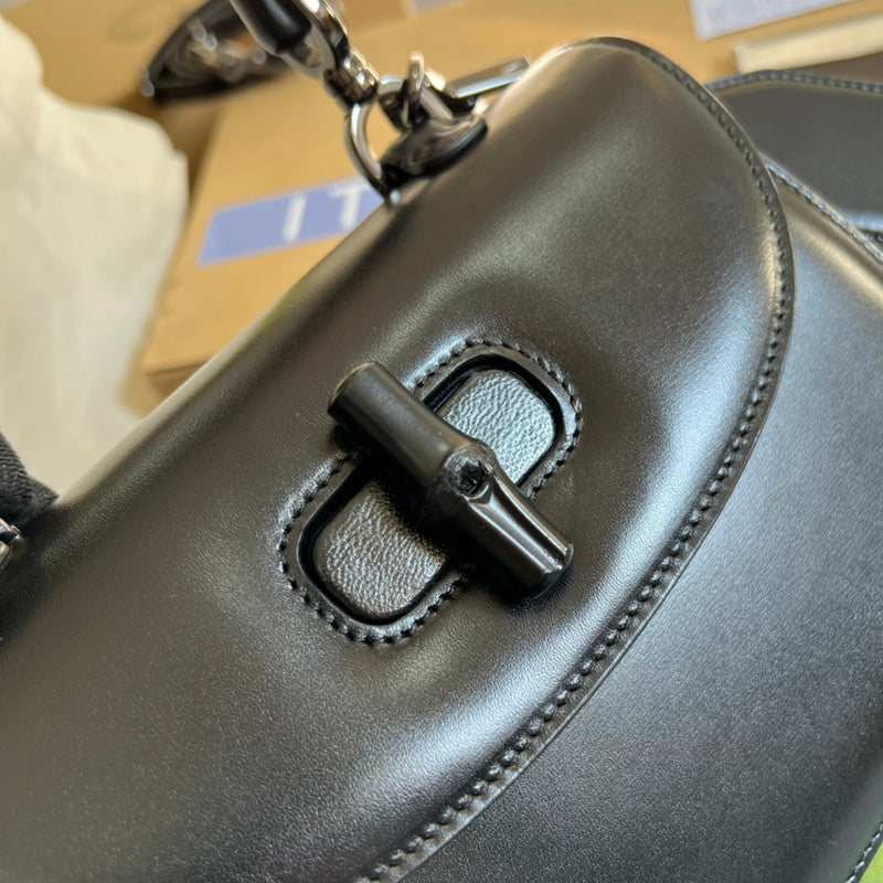Styled lifestyle shot of classic statement women's handbag – women's statement bag