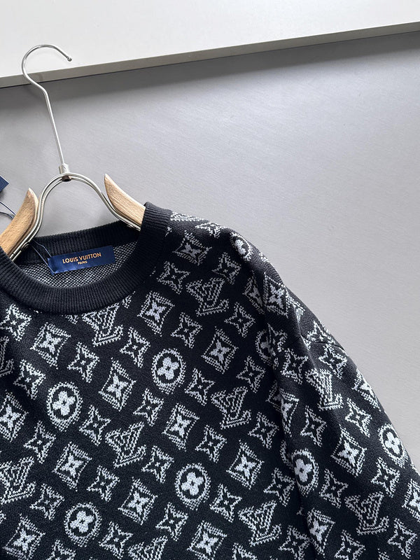 Close-up detail shot of Louis Vuitton luxury clothing with logo-detail design