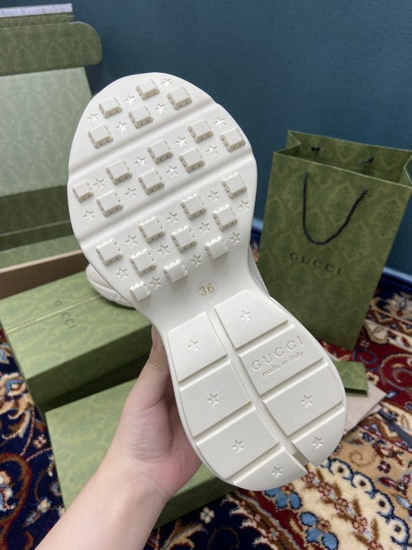Side profile of Gucci stone beige sneakers classic court silhouette
