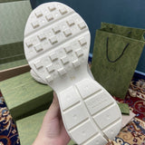 Side profile of Gucci stone beige sneakers classic court silhouette
