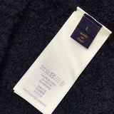 Side profile of Louis Vuitton luxury clothing with label-forward styling