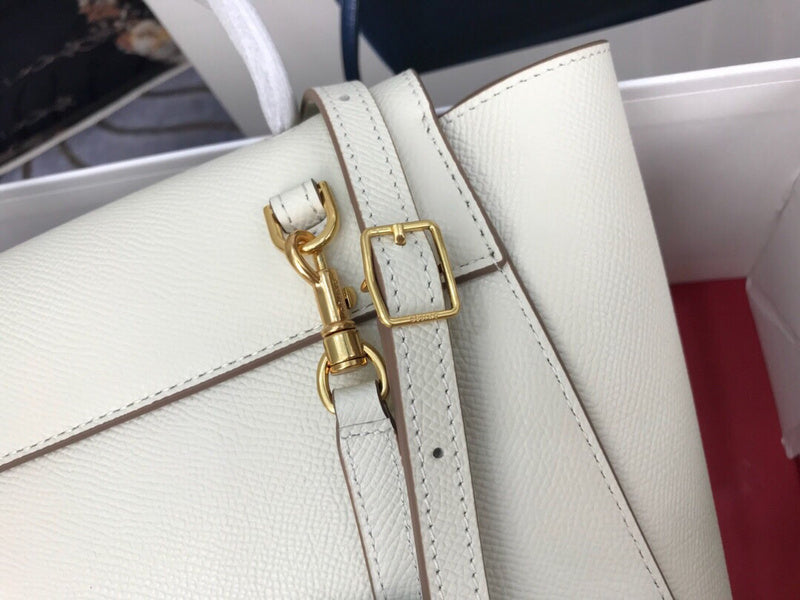 Styled lifestyle shot of statement structured women's handbag – women's luxury accessory