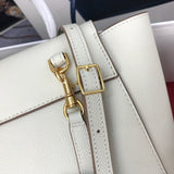 Styled lifestyle shot of statement structured women's handbag – women's luxury accessory