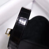 Side view of understated structured handbag