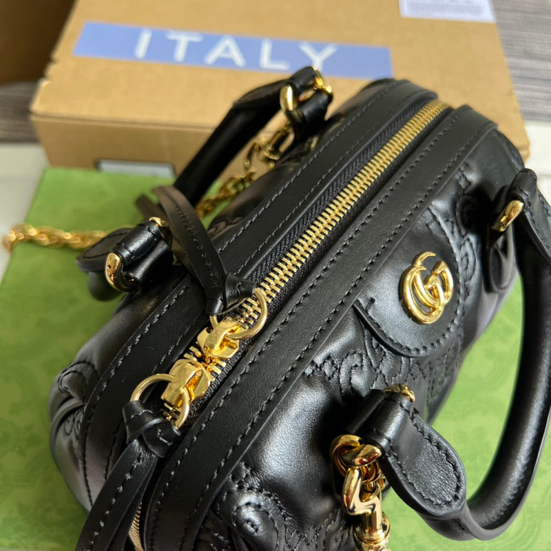 Close-up detail of structured polished women's handbag – women's luxury accessory