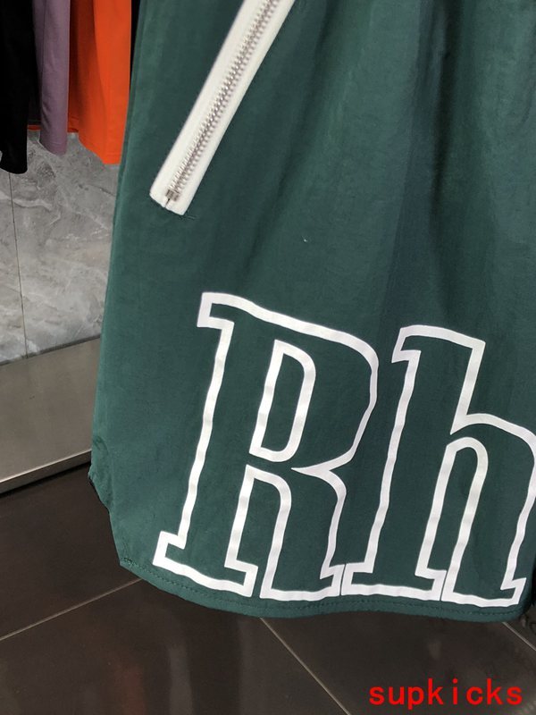 Flat lay presentation of Rhude luxury clothing with logo-detail design