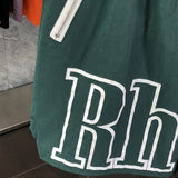 Flat lay presentation of Rhude luxury clothing with logo-detail design