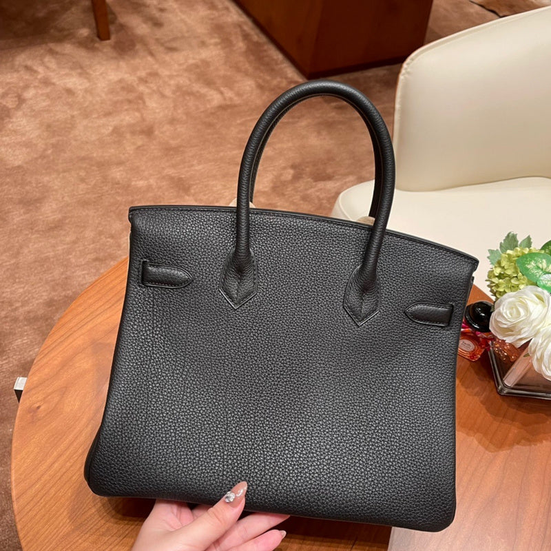 Side view of timeless structured handbag