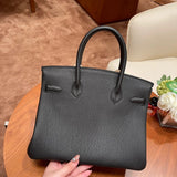 Side view of timeless structured handbag