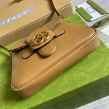 Side profile of structured polished women's handbag – women's designer-style accessory