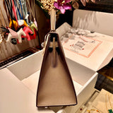  Structured top-handle bag carried on shoulder