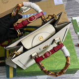 Handle and strap detail of everyday-luxe polished women's handbag – women's statement bag