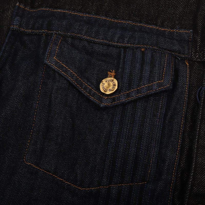 Close-up detail shot of Louis Vuitton luxury clothing with logo-detail design