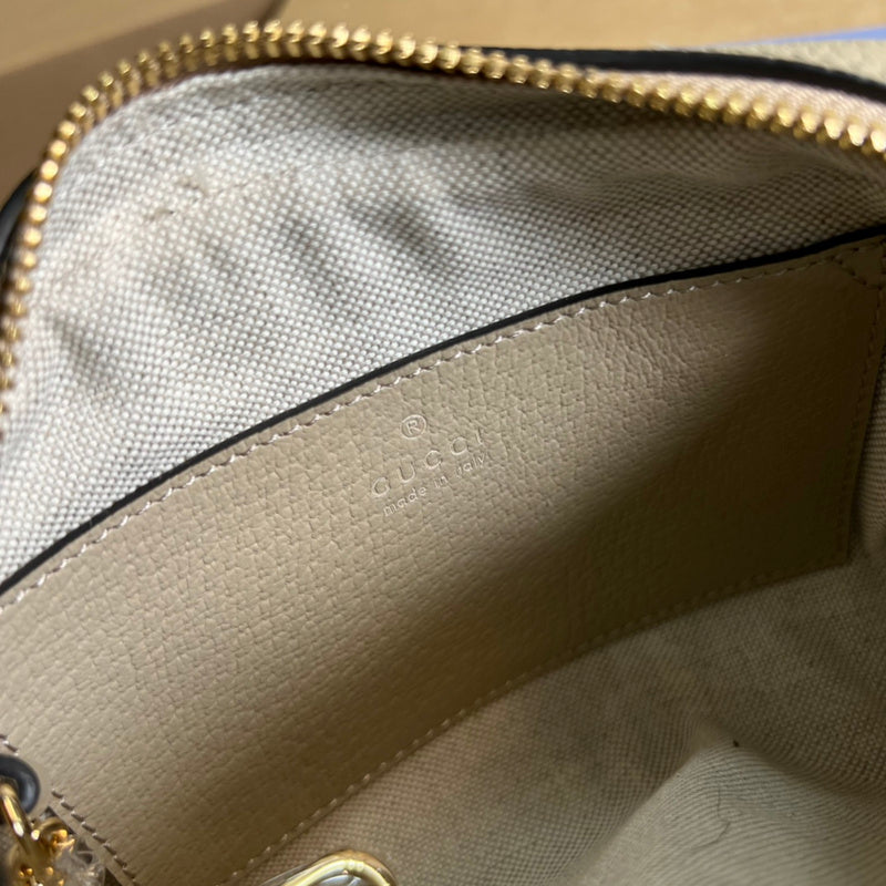 Side profile of sleek signature women's handbag – women's luxury handbag