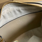 Side profile of sleek signature women's handbag – women's luxury handbag