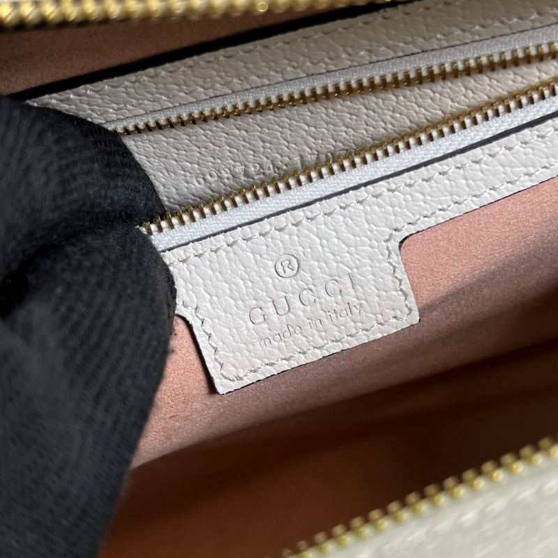 Close-up detail of statement polished women's handbag – women's luxury accessory