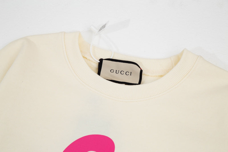Close-up detail shot of Gucci luxury clothing with relaxed-fit cut
