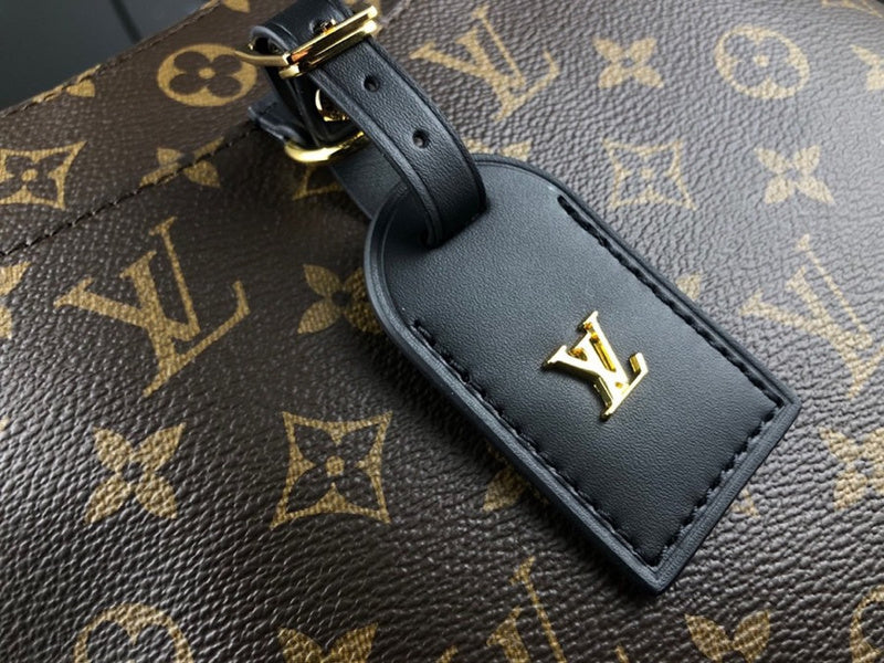 Styled lifestyle shot of classic sleek women's handbag – women's statement bag